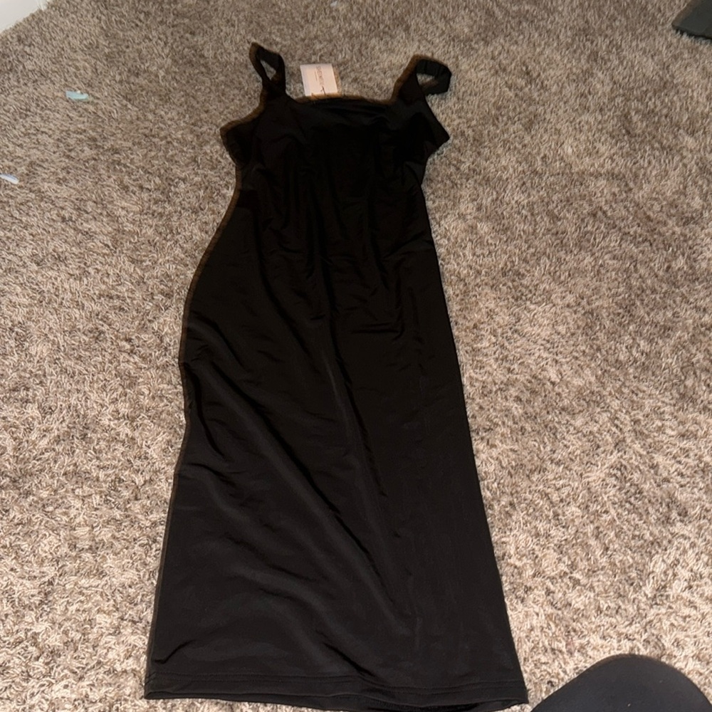 Long black body dress. Very silky and never worn once